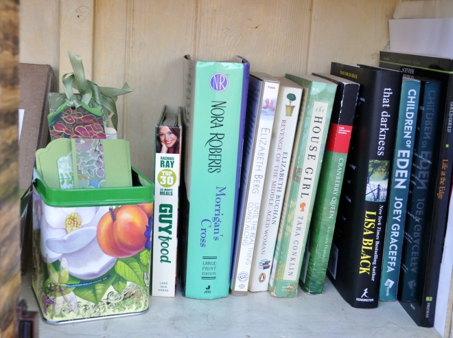 Little Free Library with green books