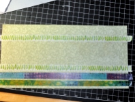 I layered rows of Washi tape across this scrap of green floral