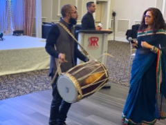 Drumming as the couple enters the room